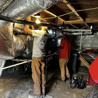 Dave's Air Conditioning Plumbing and Electrical technician working on HVAC air handling equipment for air conditioning service in Spartanburg South Carolina