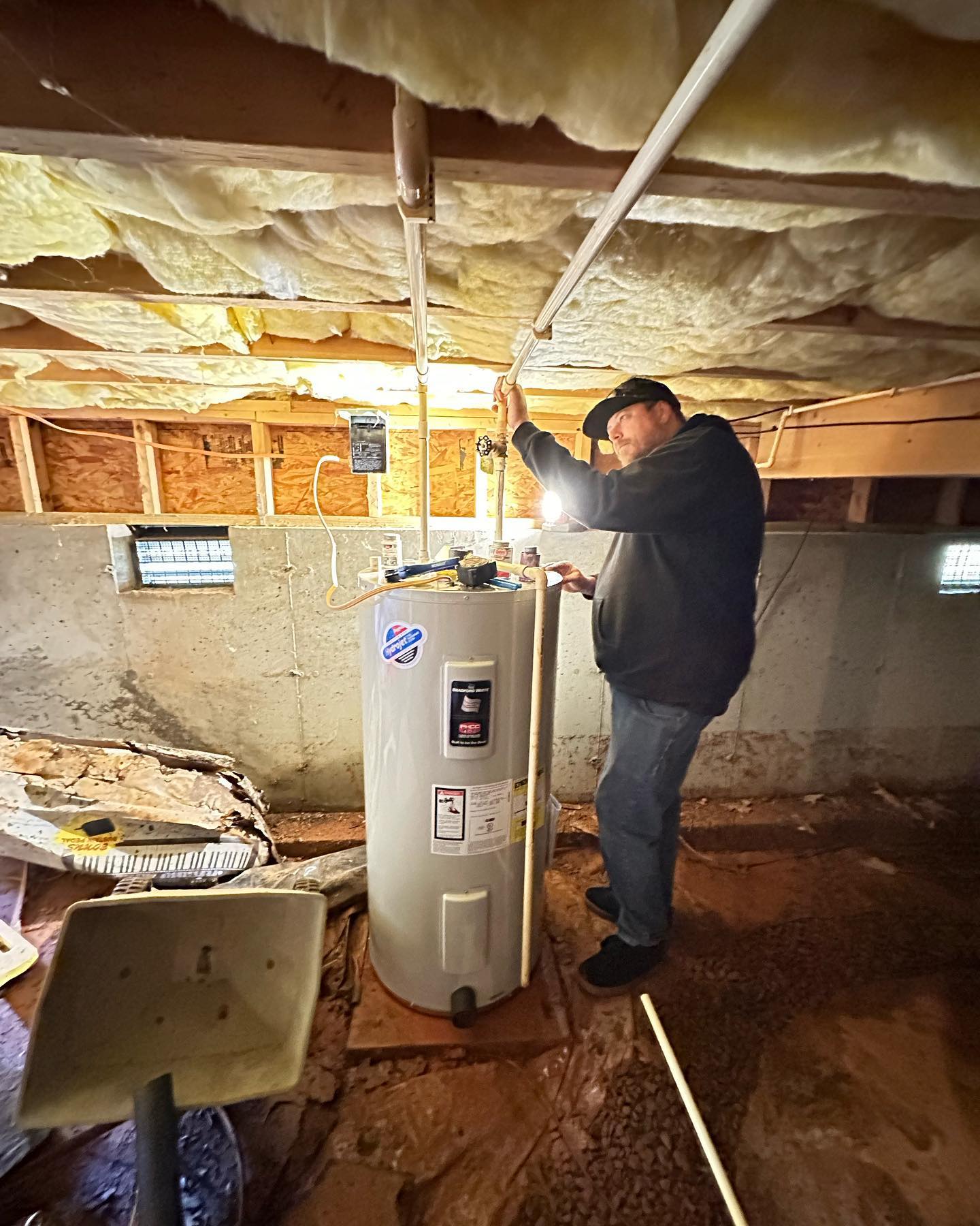 Repairing water supply lines to a water heater in a Spartanburg crawlspace