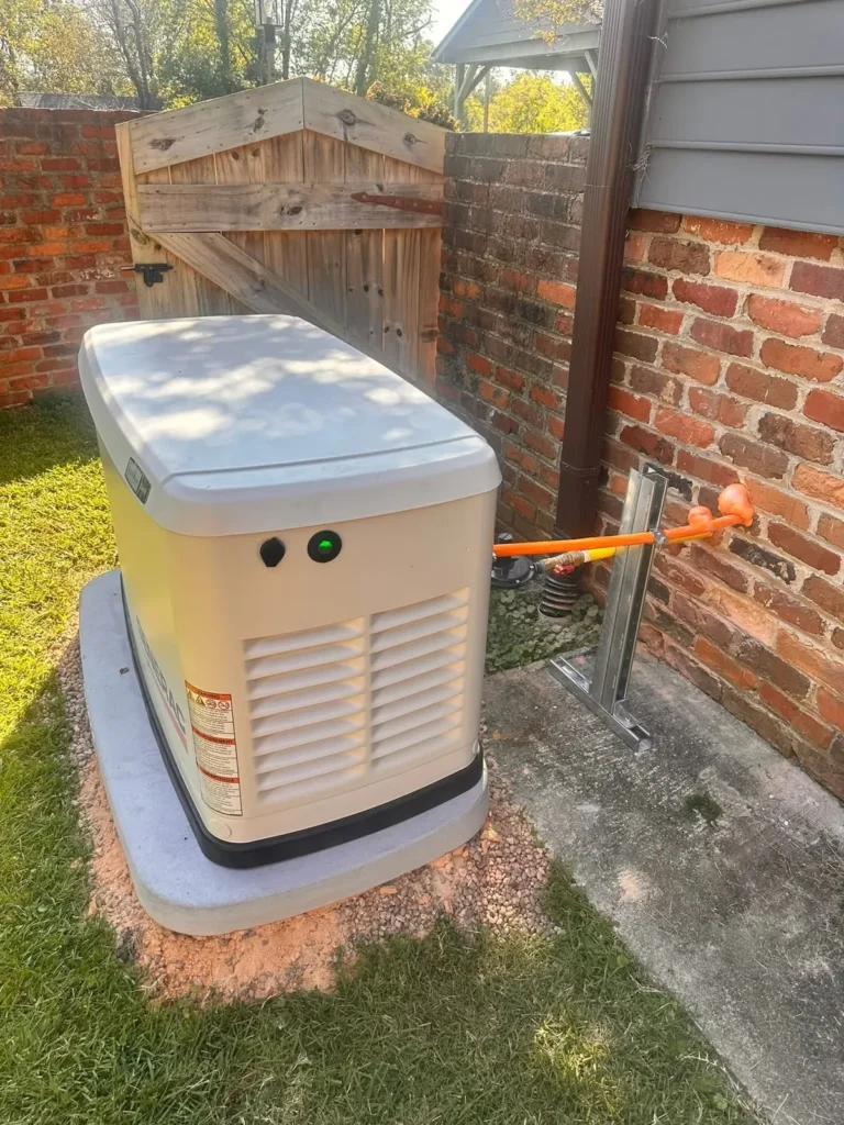 Generac standby generator installed beside a brick home in Upstate South Carolina
